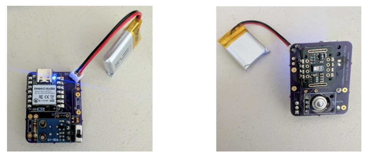 Assembled prototype of the wearable device showing the nRF52840 microcontroller board, integrated MLX90614 infrared temperature sensor, MAX30102 PPG sensor, and connected Li-ion battery