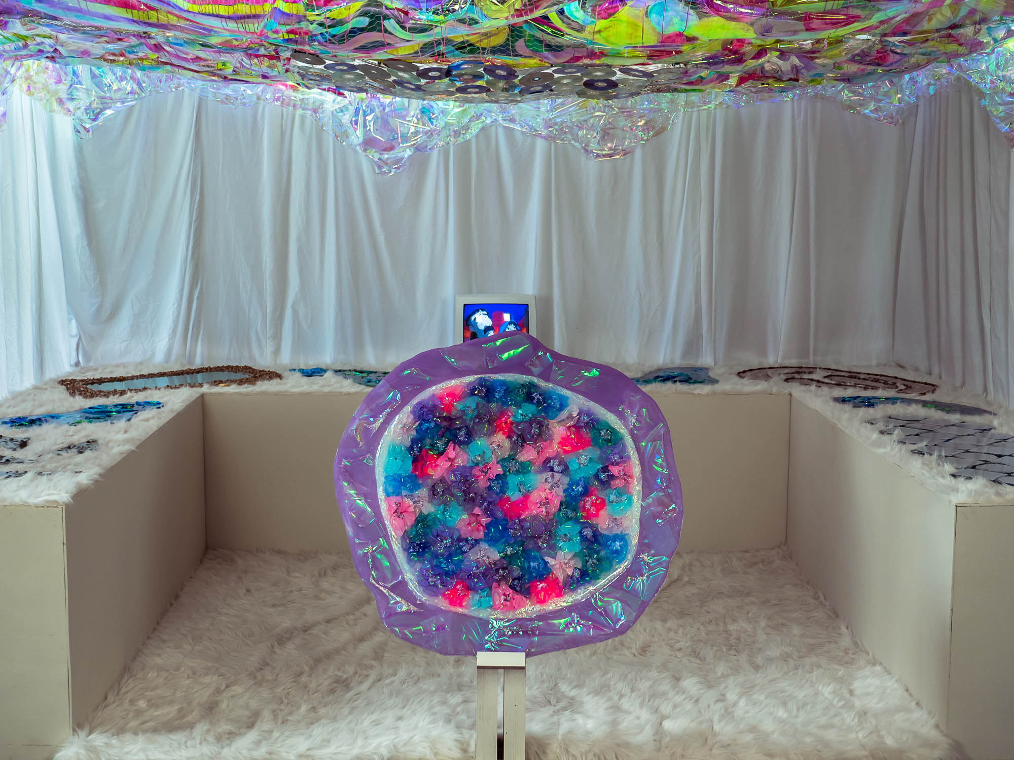 The Soul Pod is pictured, set up as it would be for exhibition. The pieces are astrologically laid out on the tables orbiting the Mystic centerpiece. The room is completely illuminated, inviting everyone to come and explore. 