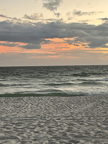 Photograph of a beach at sunset.