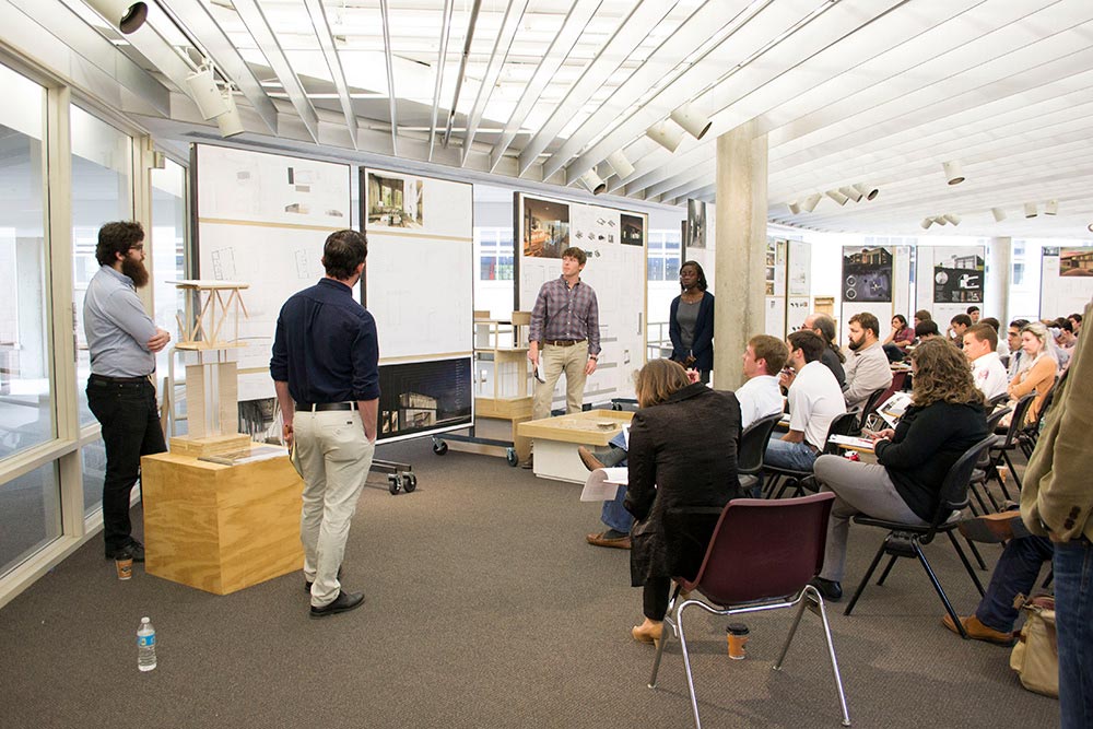 Students discussing designs
