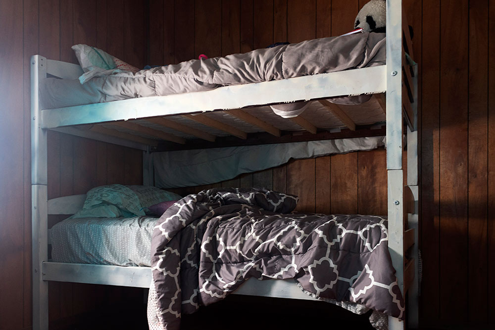 bunk beds - "she forced herself on me written on pillow on bottom bunk)