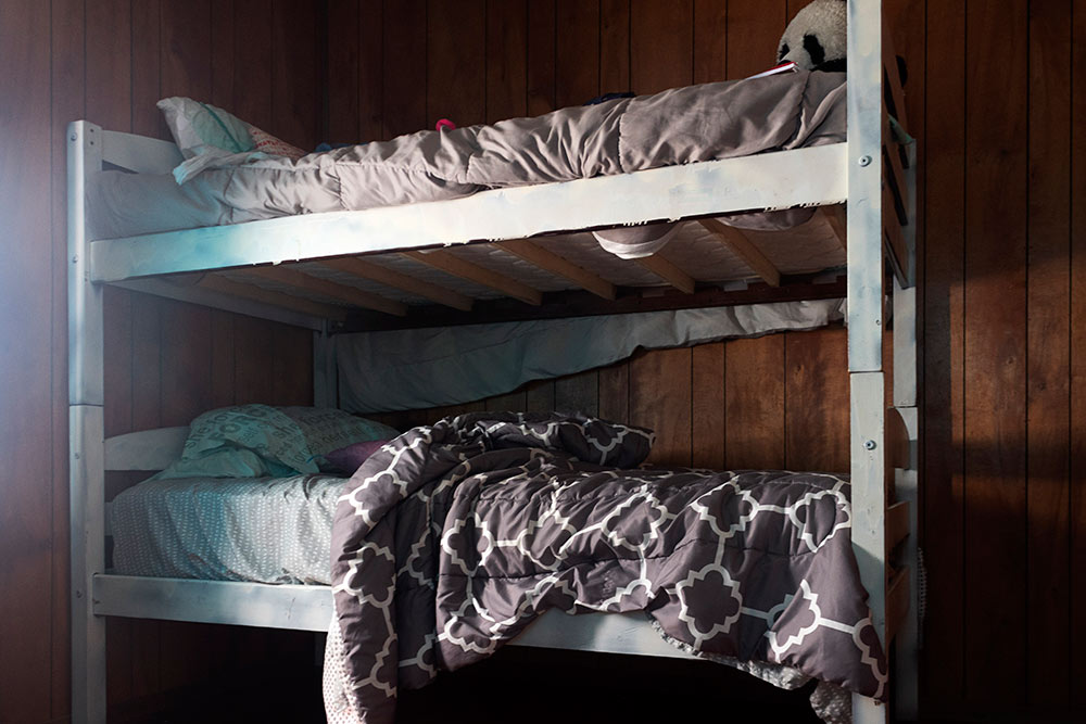 bunk beds - "she forced herself on me written on pillow on bottom bunk)