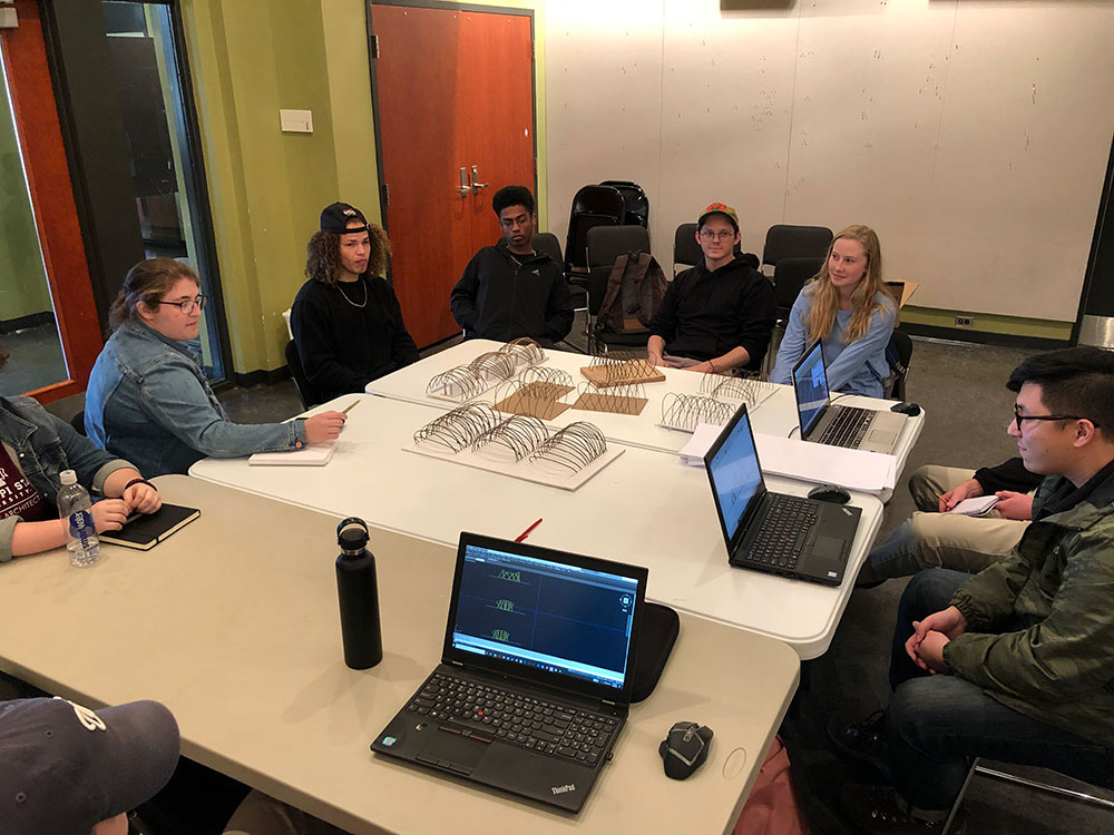 students work around a table