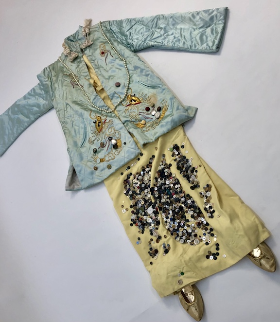 Traditional dress covered in buttons