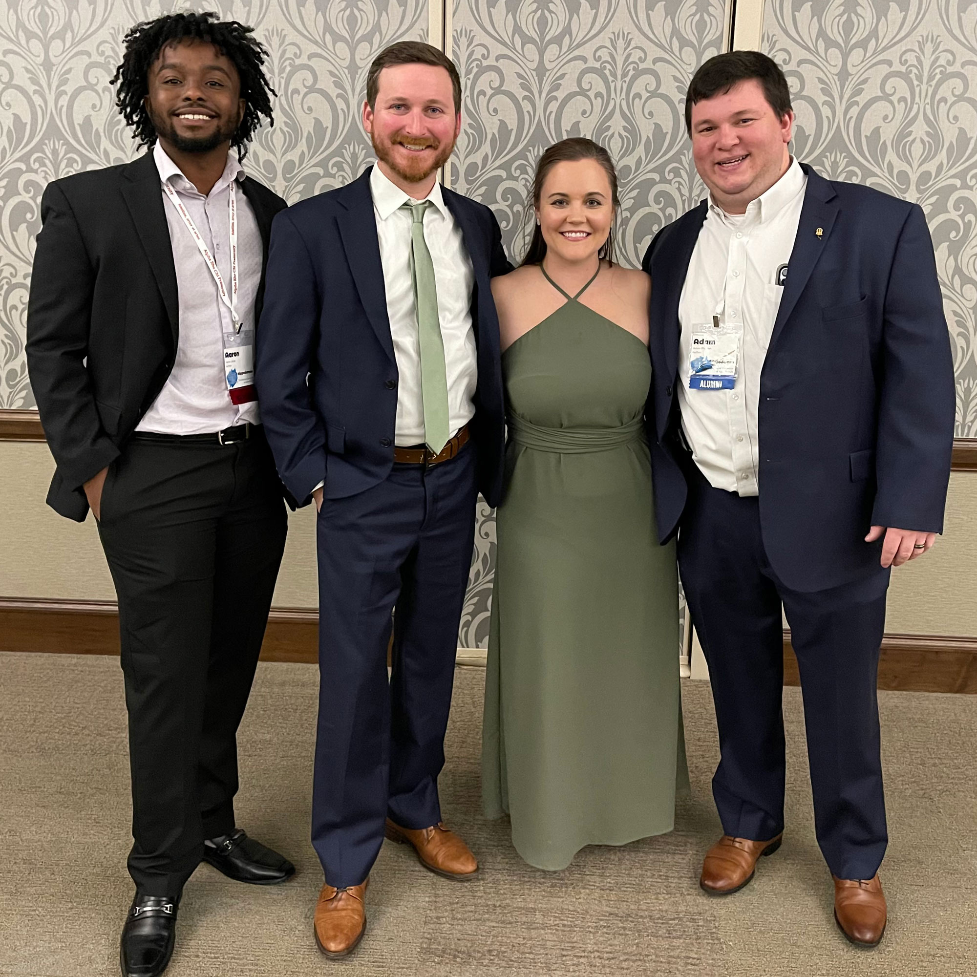 group poses for photo: left to right: Aaron Jones, Eric Lynn, Emma Kate Lynn, Adam Rhoades.