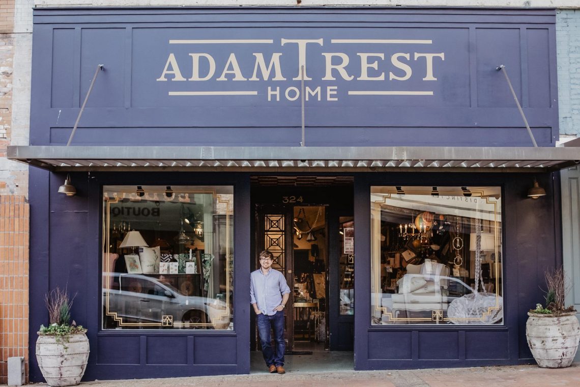 Adam Trest in front of his store