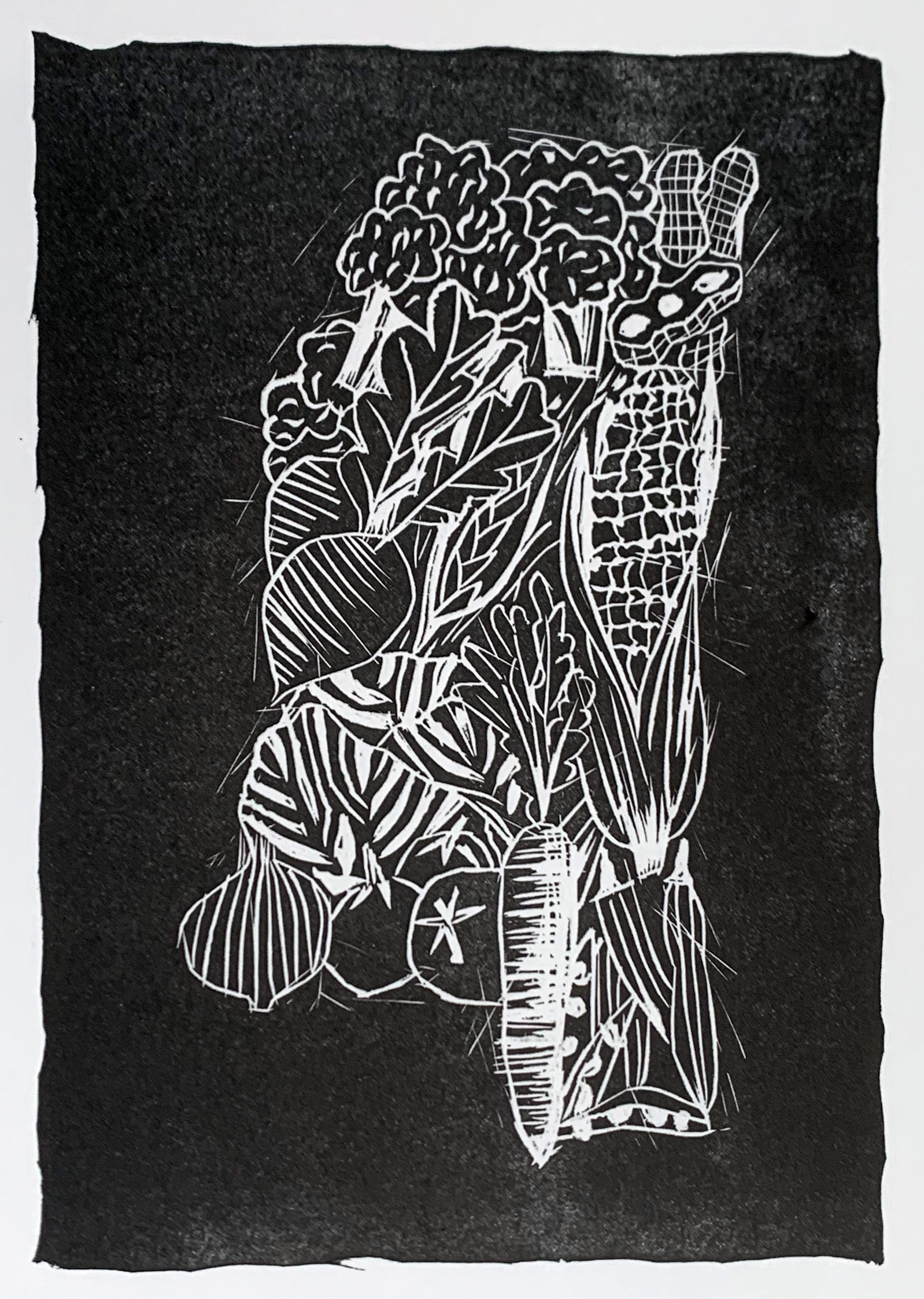 Black and white image of vegetables arranged to create the shape of the state of Mississippi.