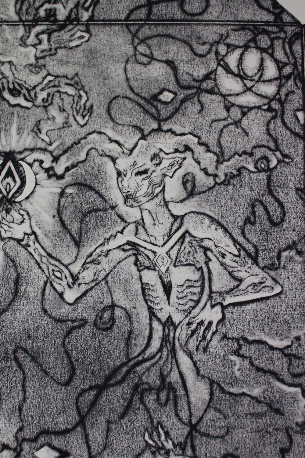 Detail shot of May The Light Rise. Grayscale imagery with organic line work and a figure with a subtle halo of light. The Supernatural creature is holding a diamond.