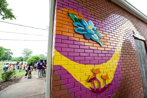 Colorful art installation on brick wall; photo by Megan Bean | Mississippi State University