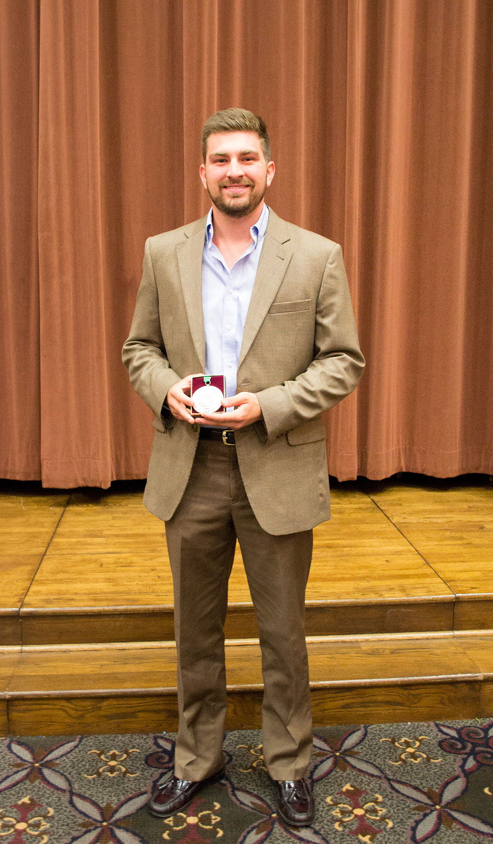 Webb Emerson holds medal