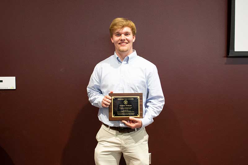 Curtis Wilson with his second-year Mississippi State University Building Construction Science Student of the Year Award