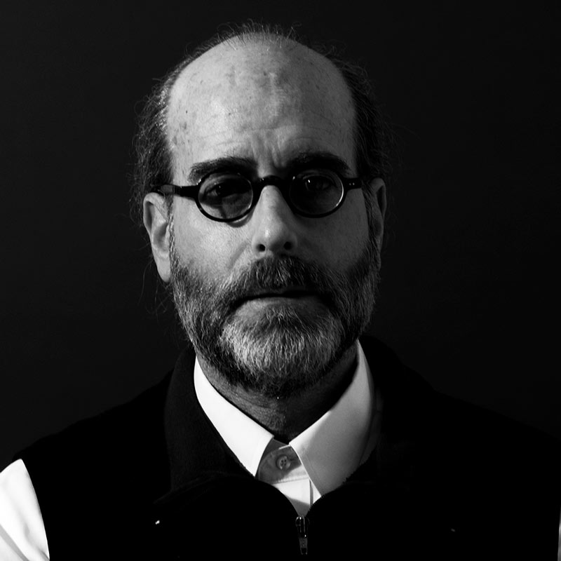 dark black and white headshot of Michael Berk