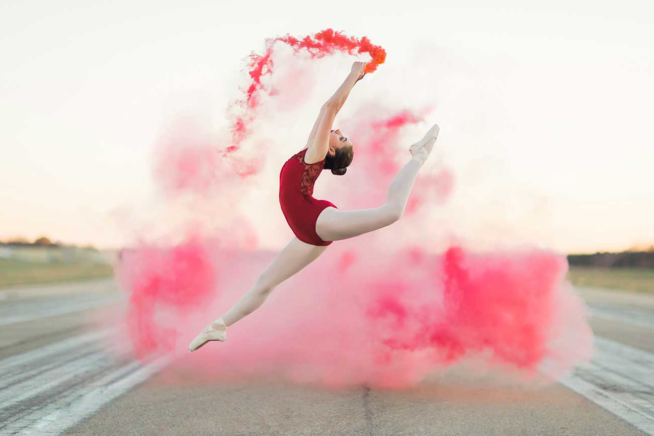 Gymnast with smoke bomb