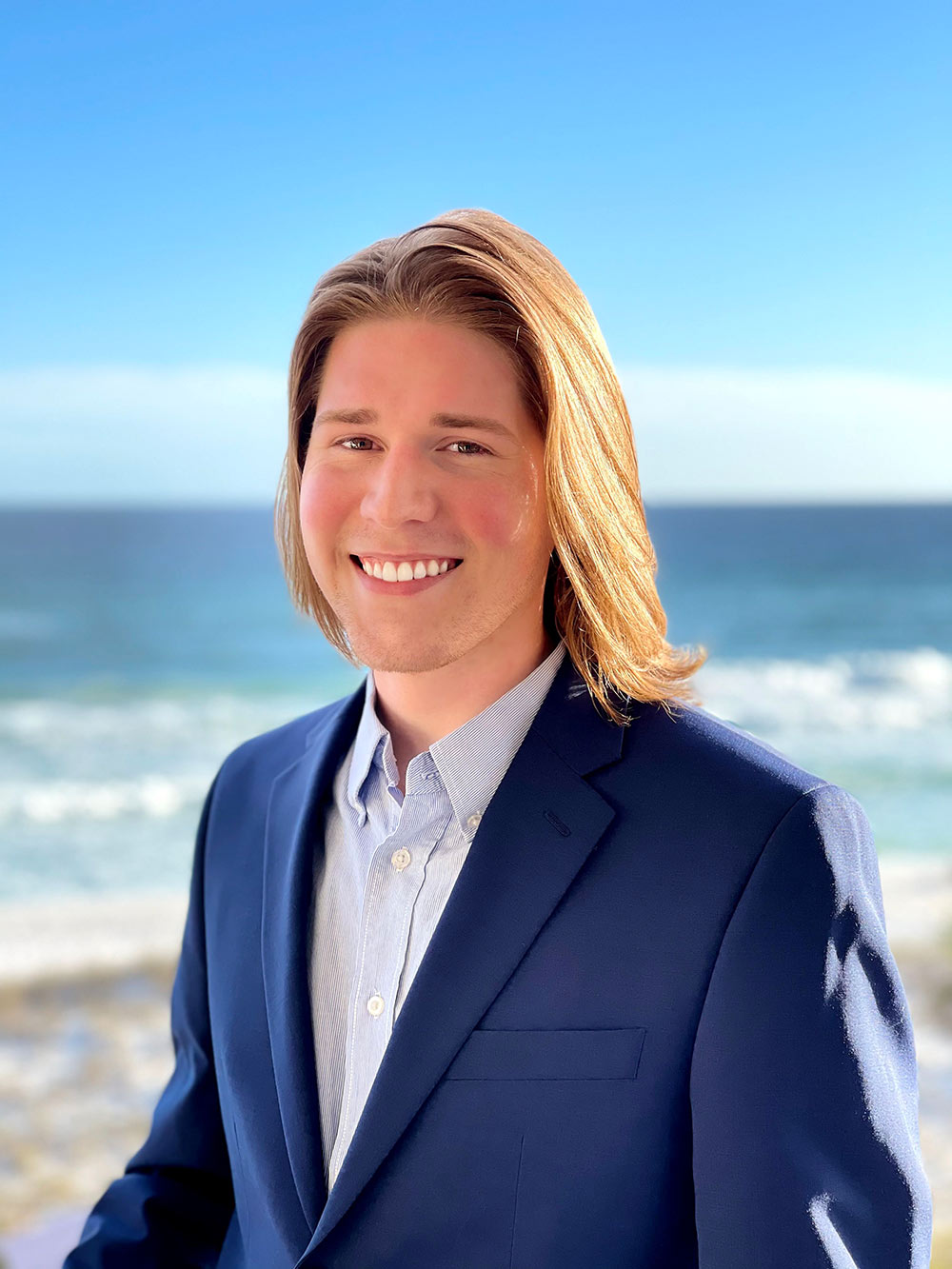 Cary Reynolds stands on beach