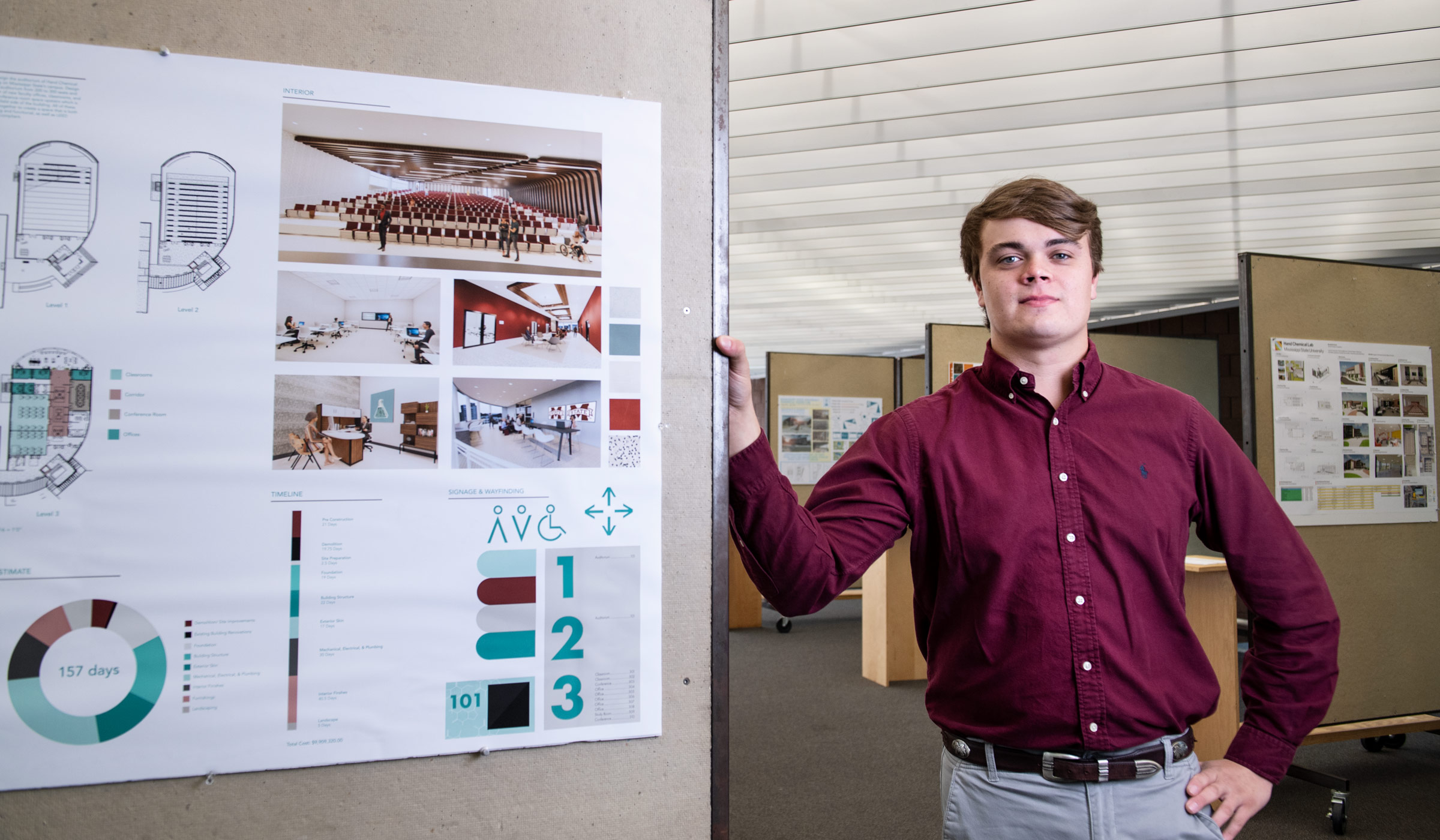 Philip Christian stands to right of his project created for the Brasfield and Gorrie Student Design Competition