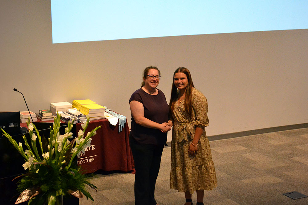 Katherine Beasley, right, poses with Professor Alexis Gregory