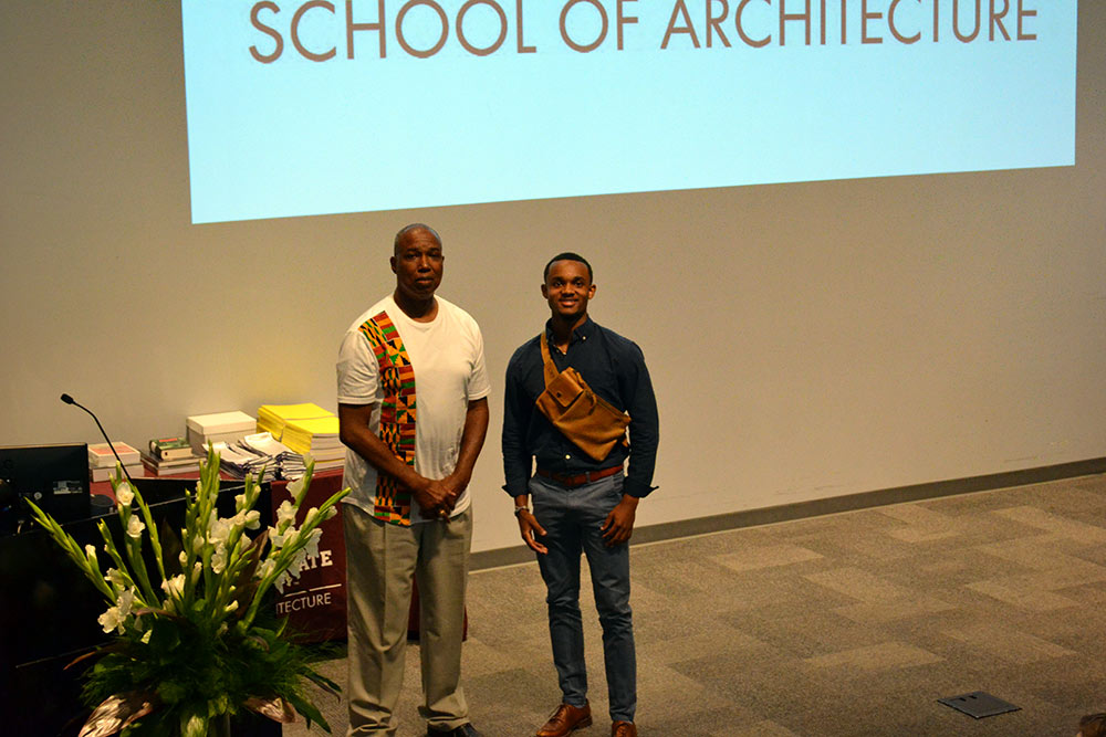 Professor Chris Hunter, left, stands with Charles Rounds