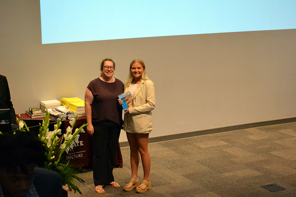 Professor Alexis Gregory, left, stands with Reagan Douglass