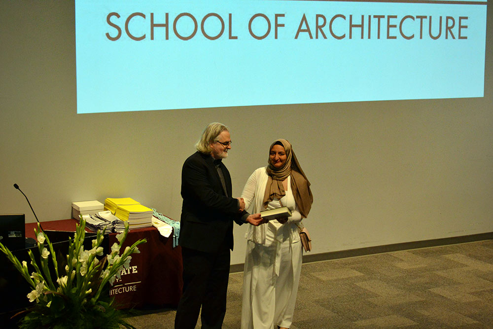 Professor Jassen Callender, left, stands with Nada Abdel-Aziz