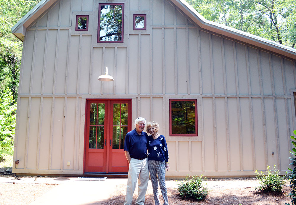 Dr. Charles Guess (left) and his wife, Rosemary, stand in front of his studio near Madison