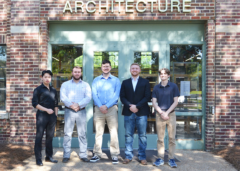 students gather in line for group photo in front of Giles Hall, left to right: Matt Wong (ARC), Drew Hill (BCS), Jonathan Jolley (ARC), Clark McKinzie (BCS), Luke Tullis (ARC)