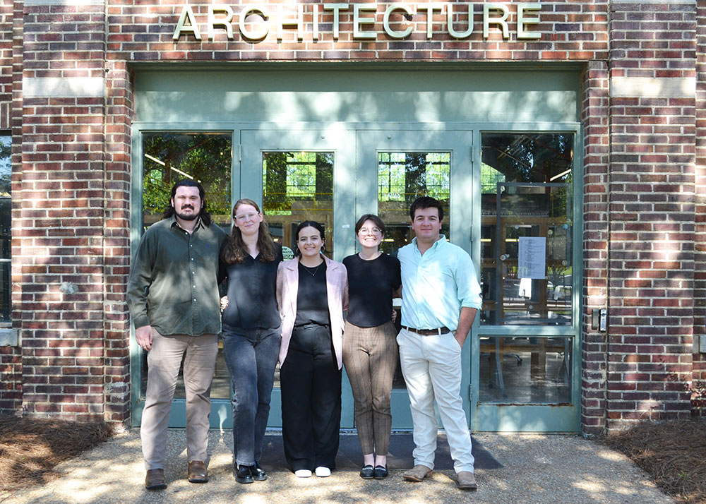 students gather in line for group photo in front of Giles Hall, left to right: Ryan McDaniel (BCS), Becca Garrick (ARC), Caeli Finch (ARC), Ellen Overstreet (ARC), Alex Tannehill (BCS)