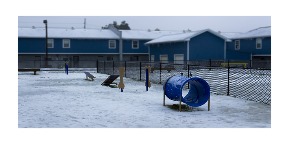 A photograph of a snowy playground