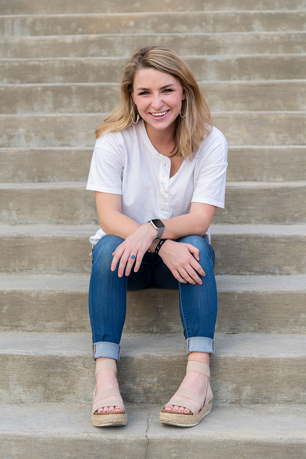 Taylor Fikes sits on steps