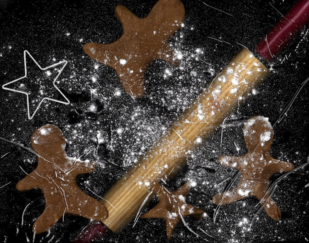 Scan of gingerbread men, rolling pin, and flour