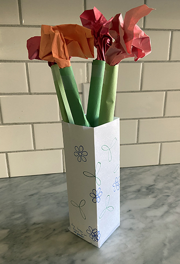 Flowers in a vase made from paper.