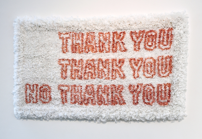 The text Thank You, Thank You, No Thank You in red on white rectangular background made from plastic trash bags.