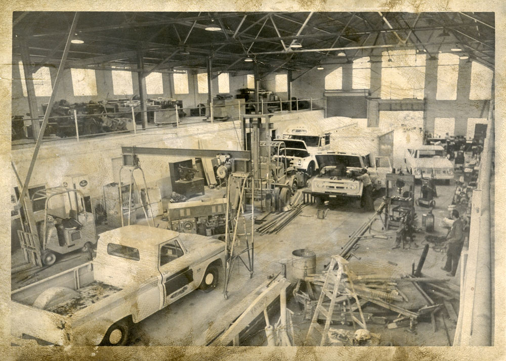 historical photo of Giles Hall interior when it was used as a motor pool