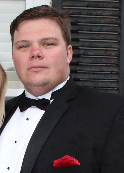 Peyton Harlow headshot in black tux