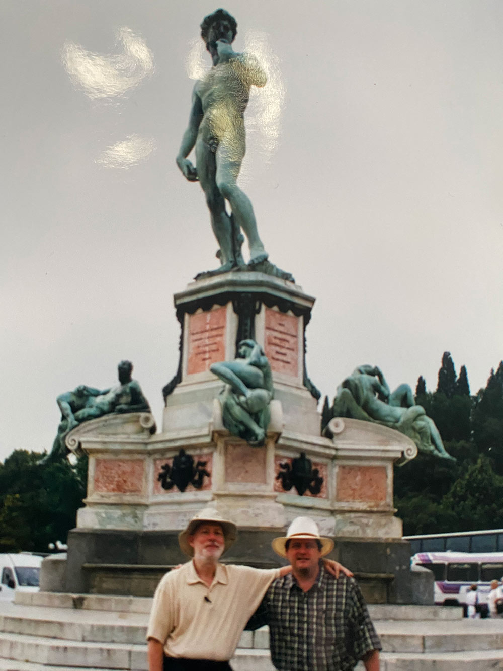 Michael Fazio, left, with Larry Albert in front of statue