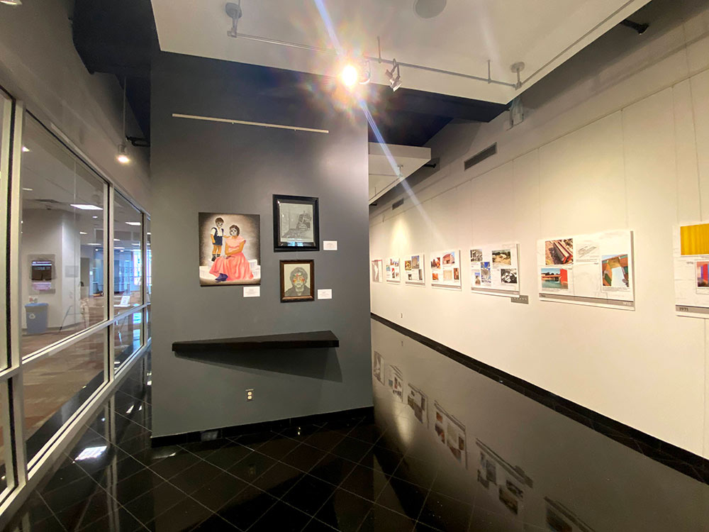 view of wall of art in gallery