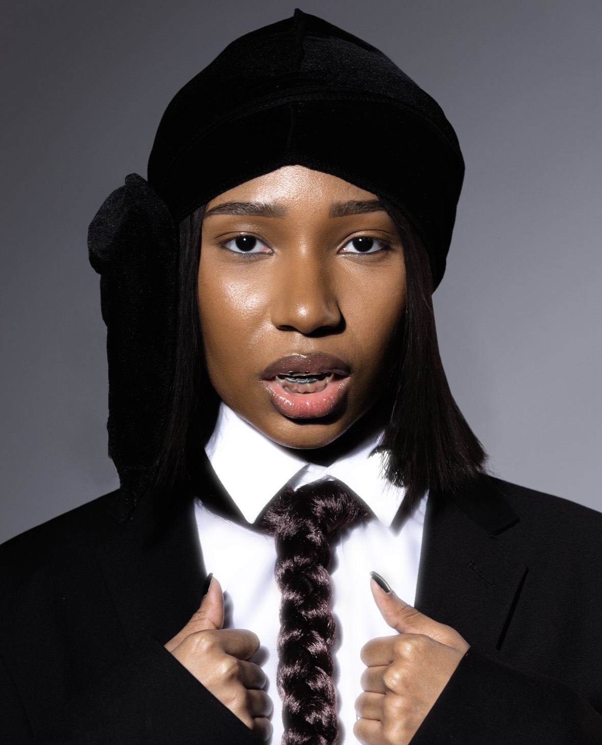 image of a woman in a black suit by Jahari Bell