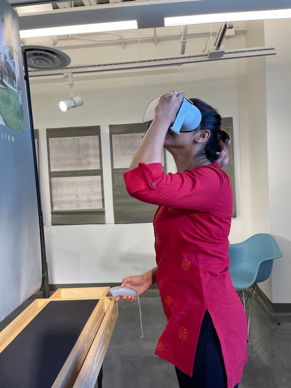Woman with VR goggles at Hans Herrmann's exhibit