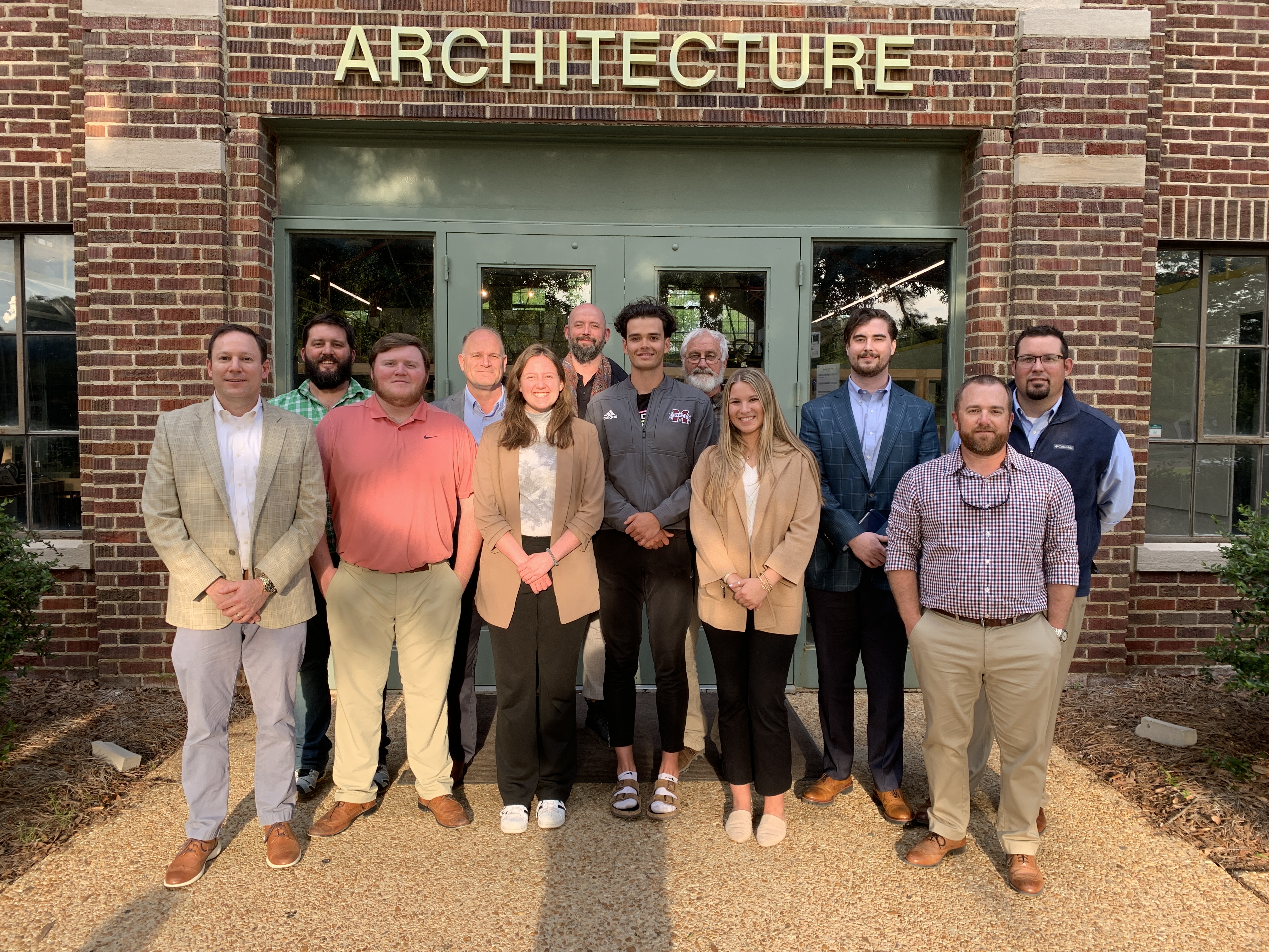 Pictured from left to right: Matt Devoss (Jackson Precast), Jesse Morrison (Starkville Area Habitat for Humanity and MSU Faculty), Chapman Cooper (BCS Student), Dan Eckenrode (PCI Gulf South), Elaine Otts (ARC Student), Charles Jones (Tulane University and another PCI Foundation Professor), Kobe Clouthier (ARC Student), John Breazeale (Starkville Area Habitat for Humanity), Elizabeth Gallagher (BCS Student),  Duncan Thomas (Kimberly Brown Architects and SARC Alumni), Andy Westfall (Tindall Precast), Tom Moore (Tindall Precast). Missing from photo Jacob Bryson (ARC Student)