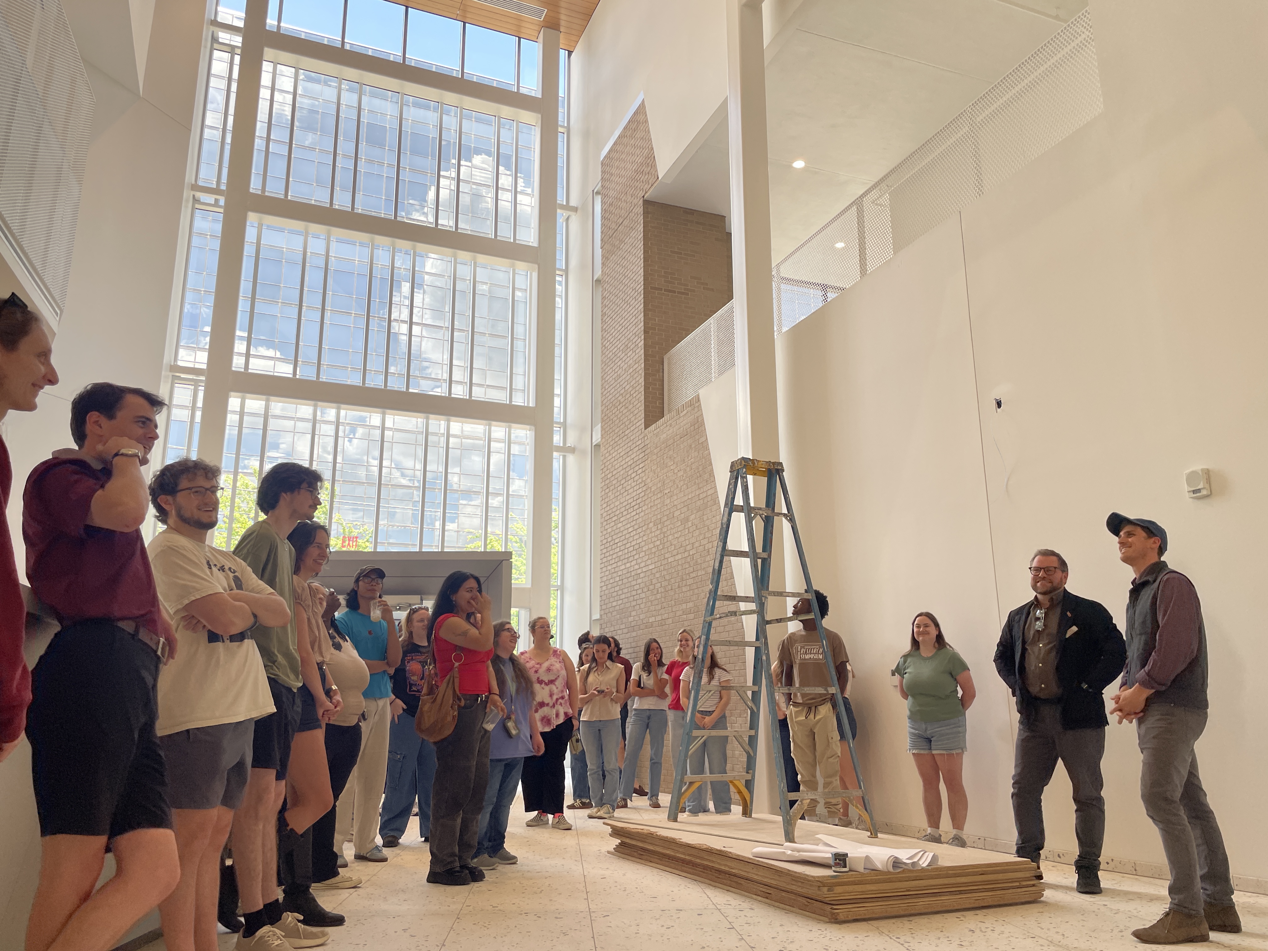 Students gather in the Jackson Planetarium redesign project site.