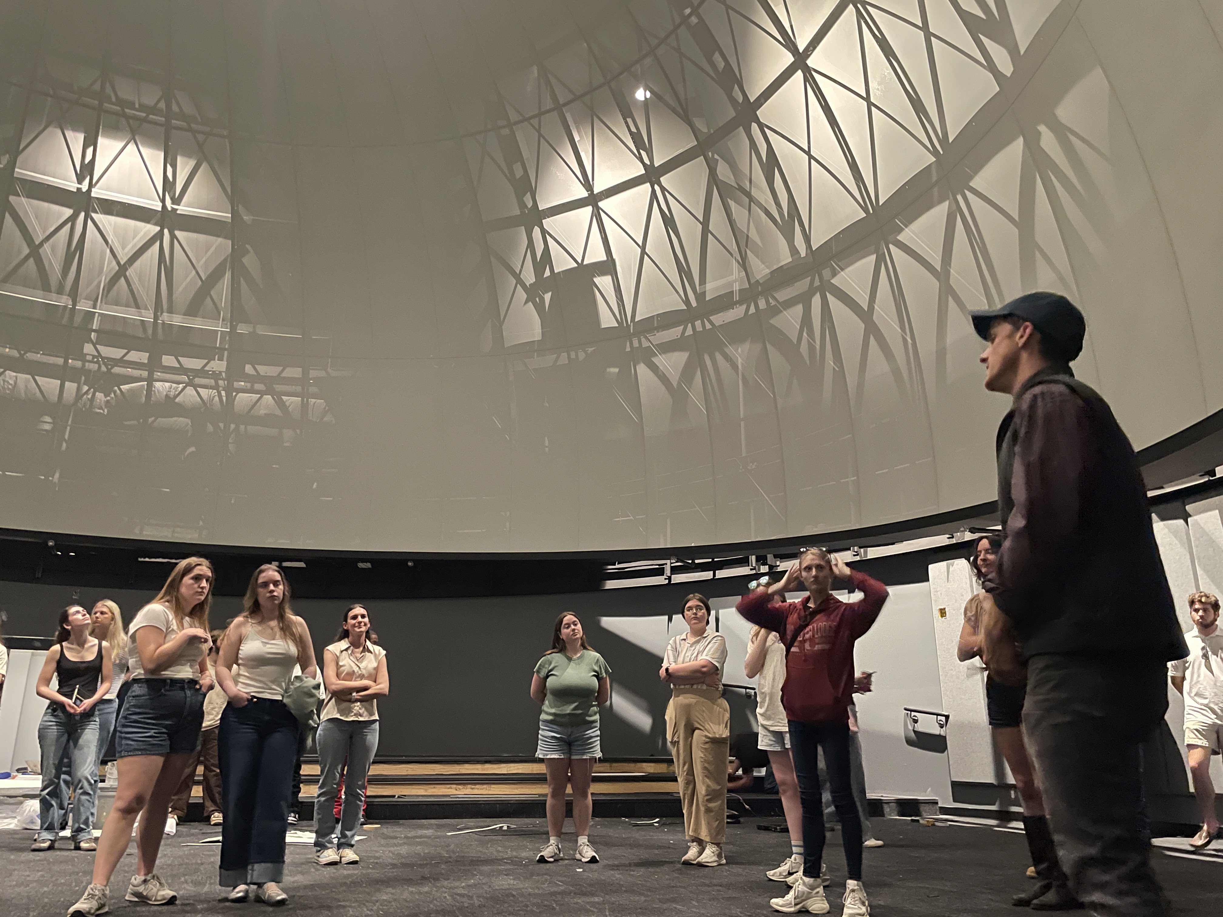 Students gather in the Jackson Planetarium redesign project site.