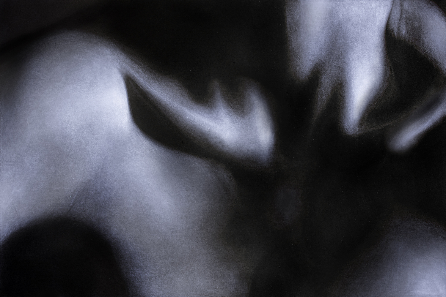 A closely cropped image of a figure’s collarbones defined by harsh shadows, featuring skin texture and the underlying skeletal structure.
