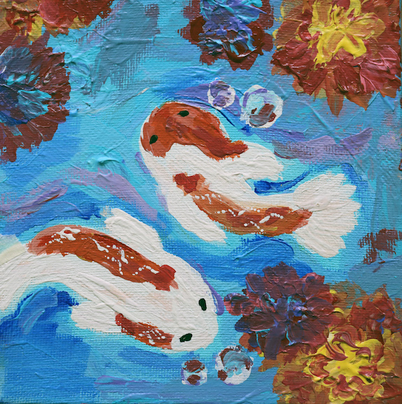 Two Koi fish swimming in a pond.