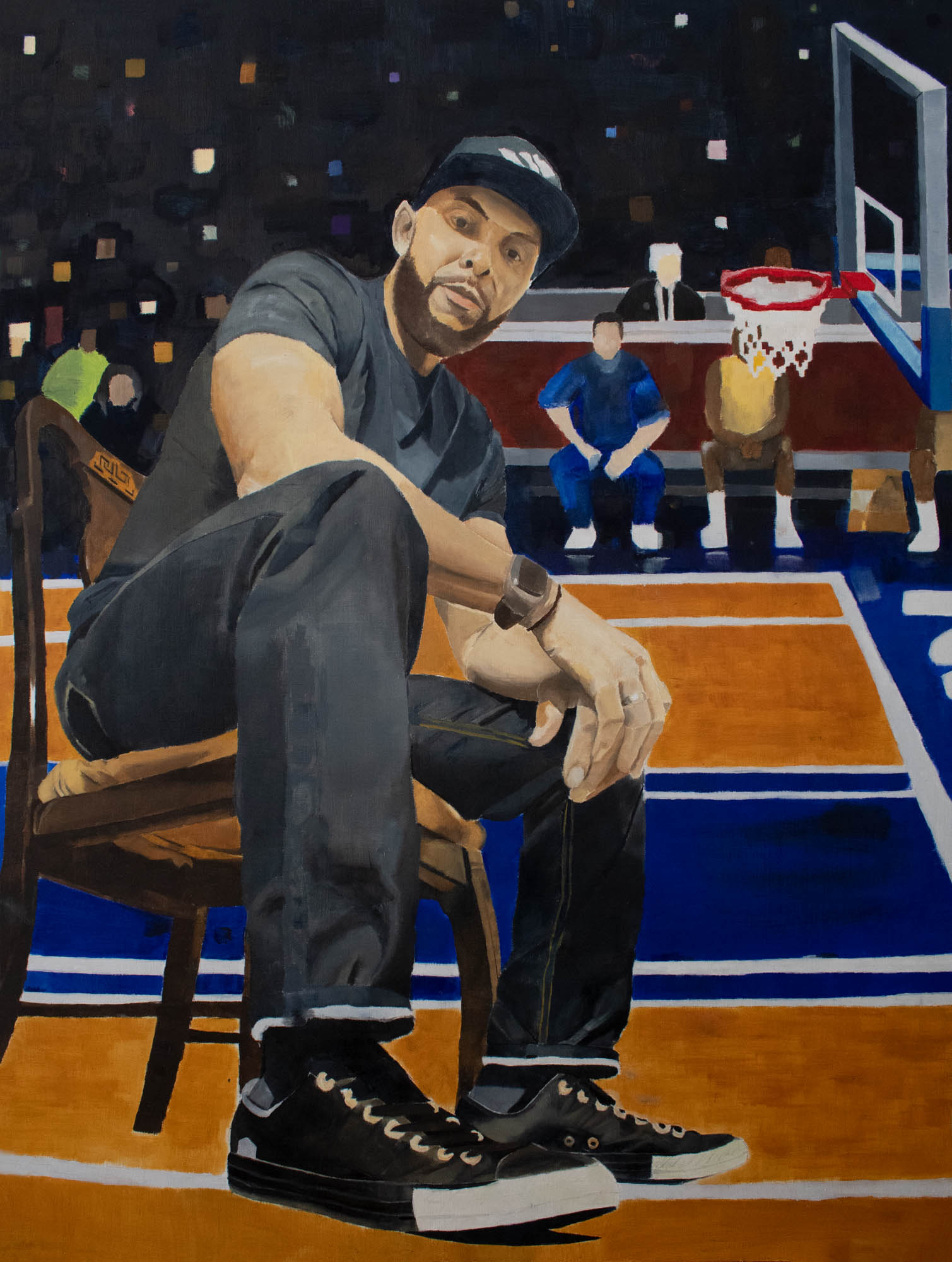 Portrait showing a man sitting in a chair with a basketball court serving as the background with colored squares serving as the audience. He is wearing pants, a shirt, hat, and a watch.