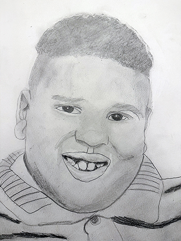 Black and white pencil drawing of a young boys smiling face.