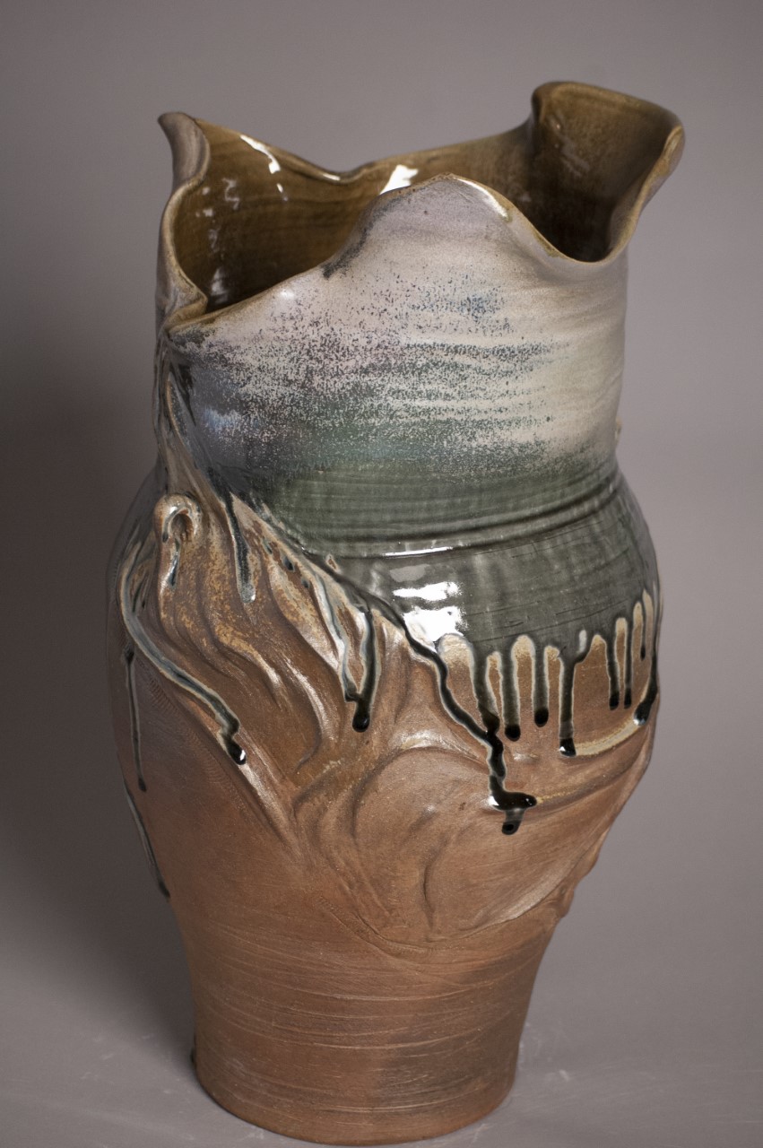 Amphora base with an organic opening with a blue green drip.