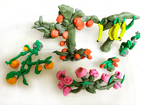 Clay sculptures of fruit trees.