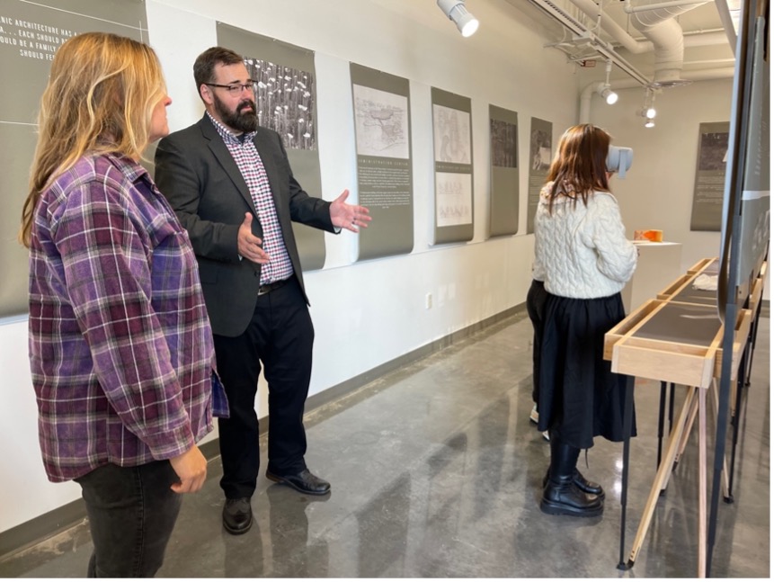 Hans Herrmann discusses a piece at his Unbuilt Crosby Arboretum exhibit.