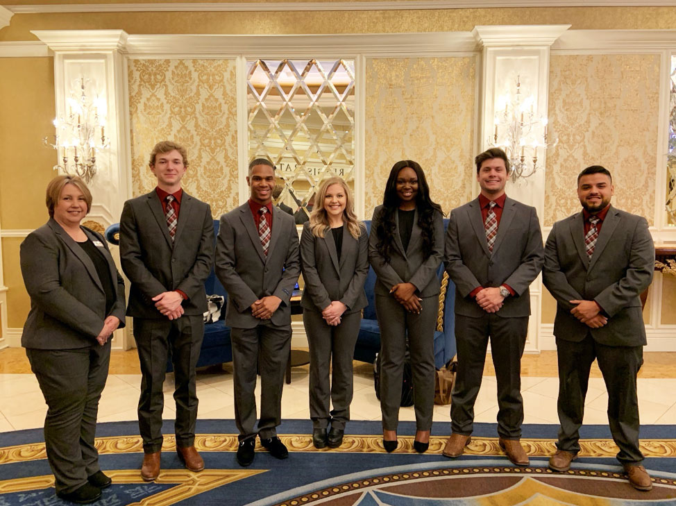 students and faculty dressed in gray suits at National American Home Builders International Builder’s Show in Las Vegas, Nevada,