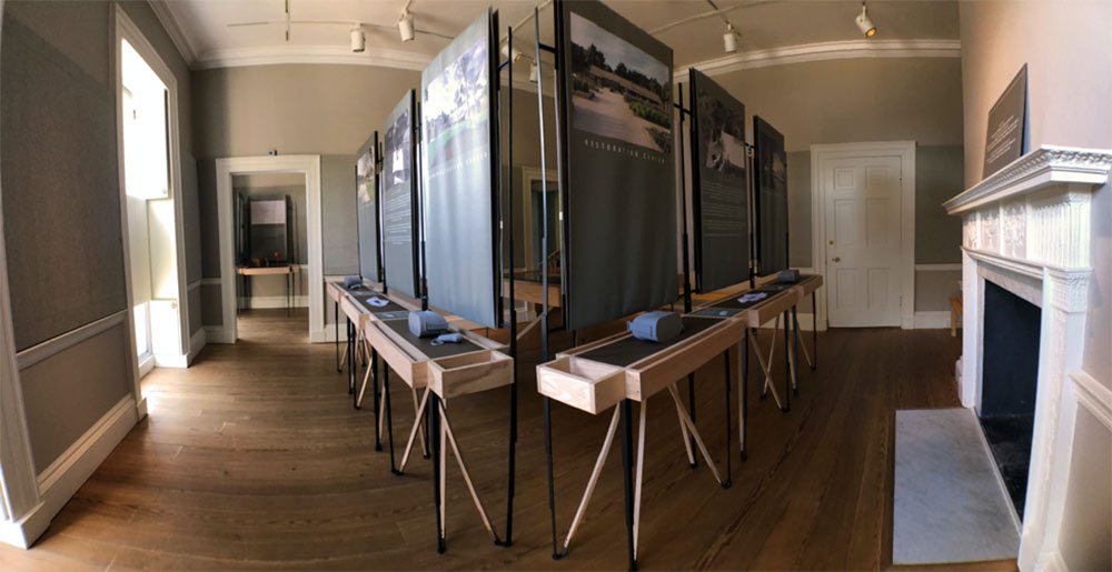 A look at "The Crosby Arboretum" exhibit set up inside The Octagon: Museum of the Architects Foundation in Washington, D.C. Two display boards are shown at a triangle angle