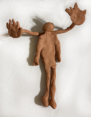 Clay figure of a person.